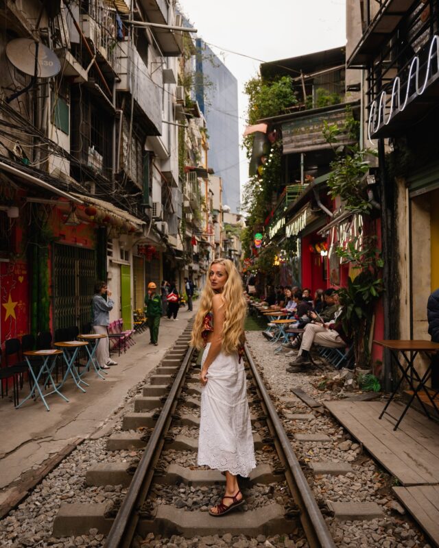 Let’s go drink tea and watch the train fly by…okay? ✨

In Hanoi you can find cafes squished right up against the train tracks. 

Just minutes before it zooms past, café owners rush to pull back tables, nudge everyone a few inches back, and then — WHOOSH — it just barrels on through, just feet away from you. 

It’s truly quite the spectacle and would absolutely never fly in the United States…but wow is it a fun experience 🚂🥰

📸 of me by @heykelseyj 💕